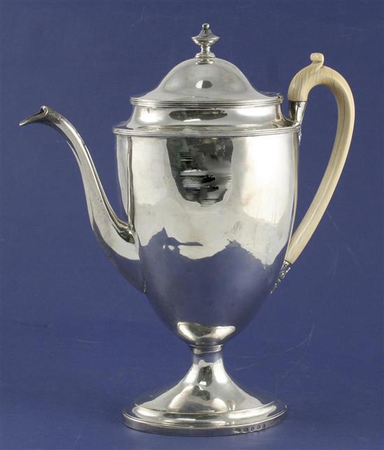 A George III silver urn shaped pedestal coffee pot, gross 27 oz.